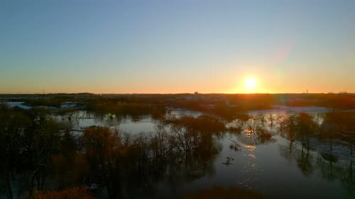 Aerial shot of winter lake at sunset