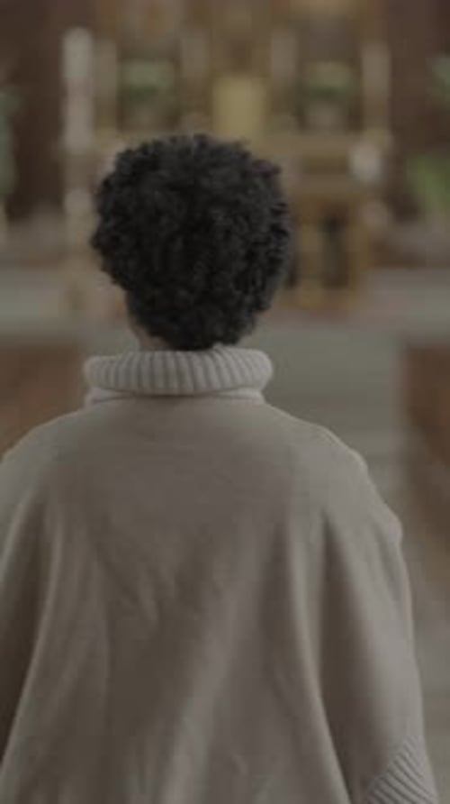 Young Adult Walking in Church for Religious Service