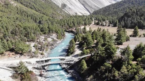 Hanging Bridge Over The Marsyangdi River On Annapurna Trek In Nepal. aerial