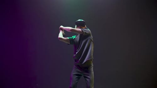 Young adult wearing VR headset interacts in virtual space