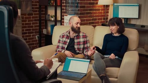 Couple Receives Counseling in Modern Office Setting