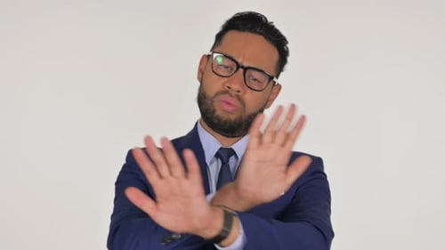 Businessman Gesturing 'No' or 'Stop' in Studio