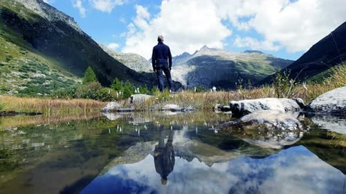 Mountains Reflected in Lake with Lone Adult