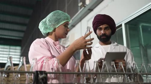 Employees are working at beverage factory.