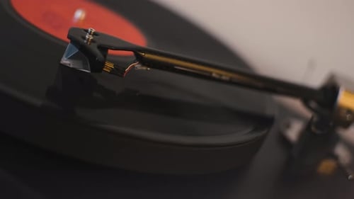A Vinyl Record Spins in the Gramophone Music Player and Plays an Old Disco Closeup Shot of Modern