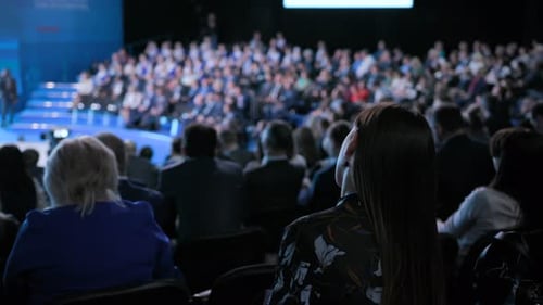 Audience Attending a Corporate Conference Presentation