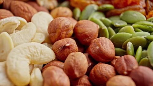 Closeup of Assorted Dried Fruits and Nuts Rotating Raw Snack Pile of Food
