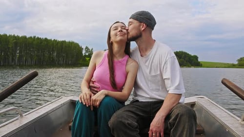 Romantic Couple Enjoying Peaceful Boat Ride on Lake