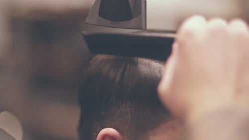 Male Hairdressing with Comb. Drying Hair Man. Close Up of Male Hair