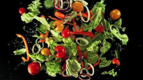 Fresh Vegetables Falling in Mid-Air on Black