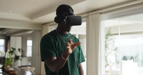 Man Wearing VR Headset Interacting with Virtual Reality
