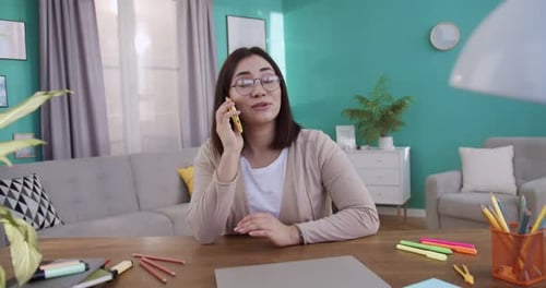 Woman Speaking on Mobile Phone at Home Office in Slow Motion Closeup Smiling Girl Talking Smartphone