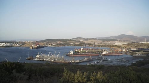 Cargo Ships Loading in Industrial Port 4K