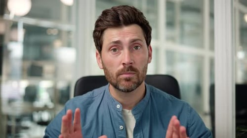 Man Talking in Modern Office Environment