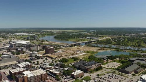 Downtown Omaha, Nebraska Skyline. Aerial Pan Left on Hot Summer Day