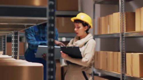 Multiethnic Team of Workers Analyzing List on Laptop