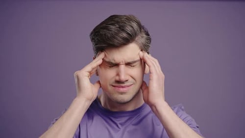 Man Experiencing Headache and Temple Pain