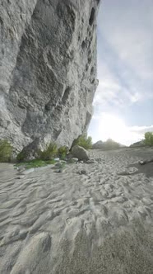 Sandy Beach Next to Large Rock