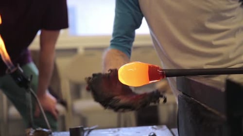 Glassblower Forming Molten Glass with Heat and Tools