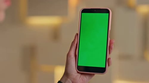 Businesswoman Holding Mockup Mobile Phone Reading Message in Office Close Up