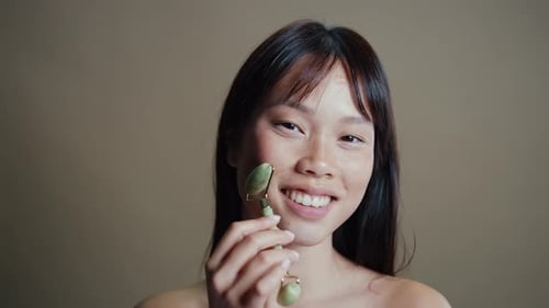 Asian woman beauty session in studio.