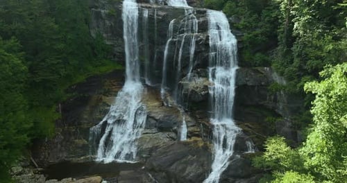 Beautiful Landscape of High Waterfall with Falling Down Clear Water From Rocky Boulders Between