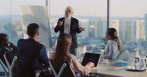 MultiCultural Group of Office Colleagues Sitting in Office Room Discussing Presentation of Old