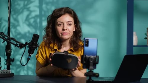 Young Woman Vlogging about VR Headset
