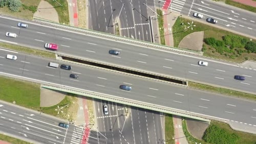 Summer aerial footage of transport junction, traffic cross road junction day view from above with hi