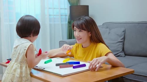 Mother and Child Drawing Together at Home