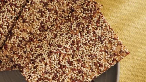 Crackers Covered in Seeds on Plate