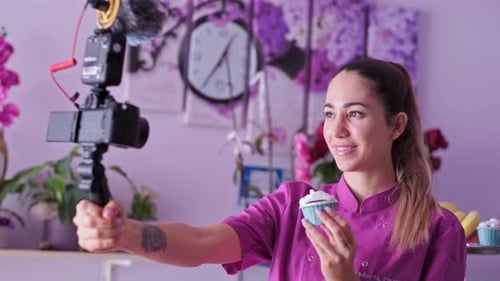 Enthusiastic Young Woman Filming Cupcake Video