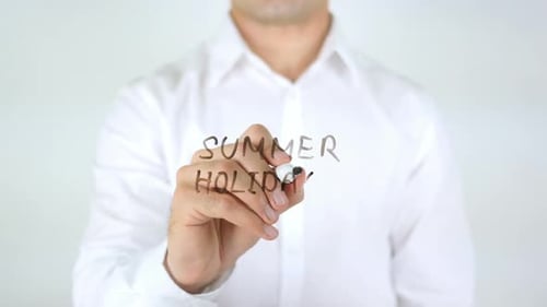 Summer Holidays Written onto Clear Surface by Adult
