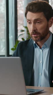 Caucasian Businessman Typing Laptop Speaking Video Call in Office ...