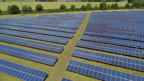 Aerial view of photovoltaic solar farm panels, United Kingdom.