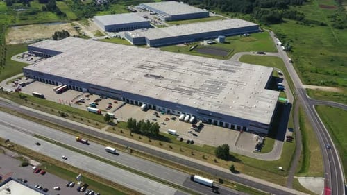 Aerial view of warehouse storages or industrial factory or logistics center from above. Aerial view