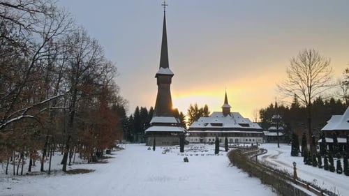 Aerial drone view of the Peri-Sapanta Monastery in winter, Romania. Main church and a building, visi