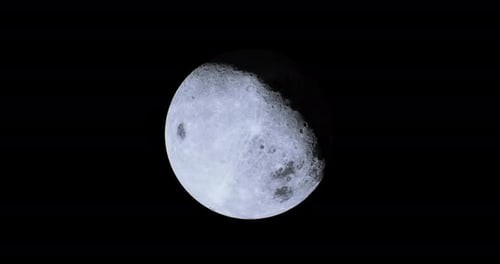 Bright and Captivating View of the Moon in a Starry Night Sky