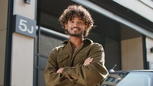 Confident Young Man Smiling Outdoors