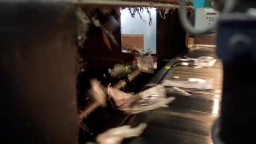 Waste Sorting Conveyor, mixed garbage stream, automated processing line, various materials moving. I