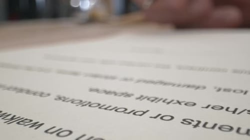 Hand Signs Document With Pen on White Paper