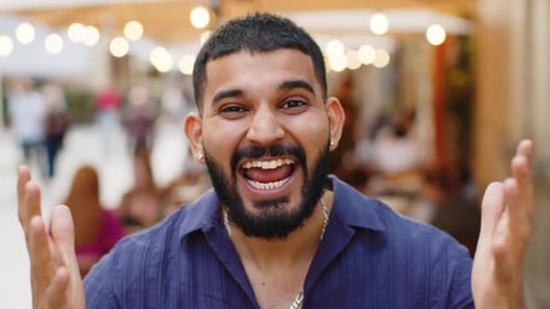 Young Man Looking Surprised at Camera Shocked By Sudden Win Good Victory News Wow in City Street