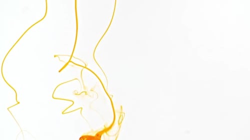 Bright Orange Ink Flowing on a White Background