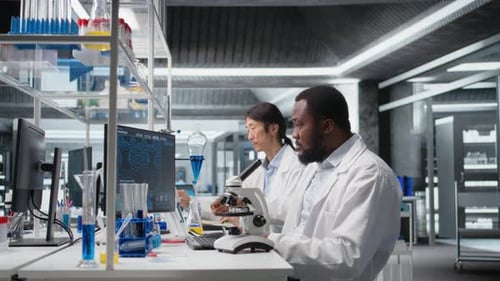 Scientists Doing Research in Modern Lab Workplace