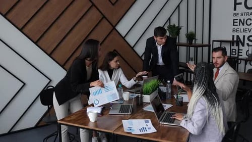 Business Team Collaborates in Modern Office Meeting