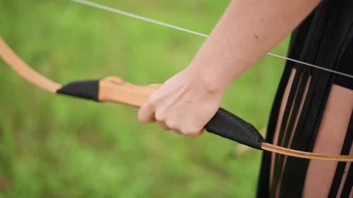 Female Archer Preparing Woman Aiming Her Bow Outdoors Focused Woman Getting Ready to Shoot Bow