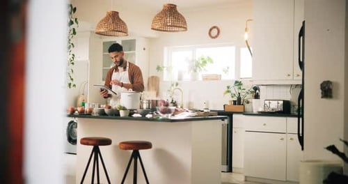 Adult Preparing Food in a Modern Kitchen