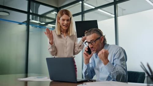 Business Colleagues Celebrating Success in Office, Modern Workplace