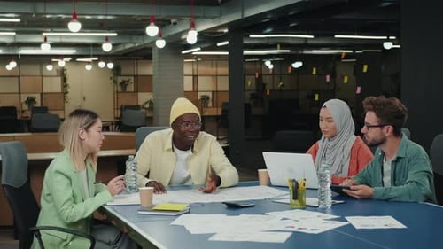 Multiethnic Team of Designers are Working on a Project in the Office