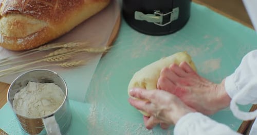 Hands Kneading Dough at Home
